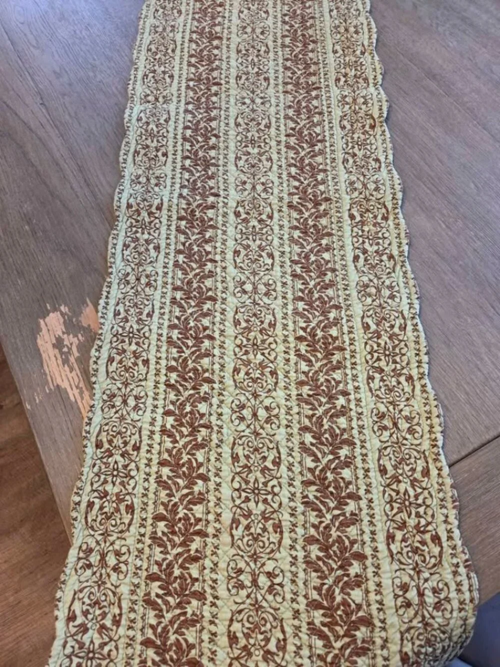 Brown and green quilted table runner